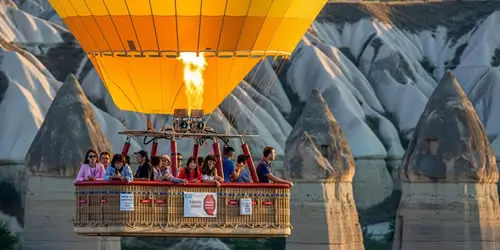 Hot Air Balloon Gliding into the Golden Sunrise